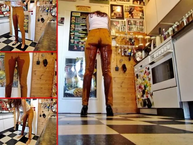 Power-Piss in der Küche - in orangeschwarzen Jeans + Pumps